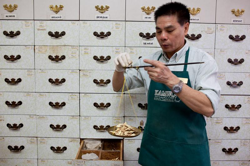 Preparing Chinese medicine prescriptions at Kamwo Herbal Pharmacy on Grand Street in Manhattan.